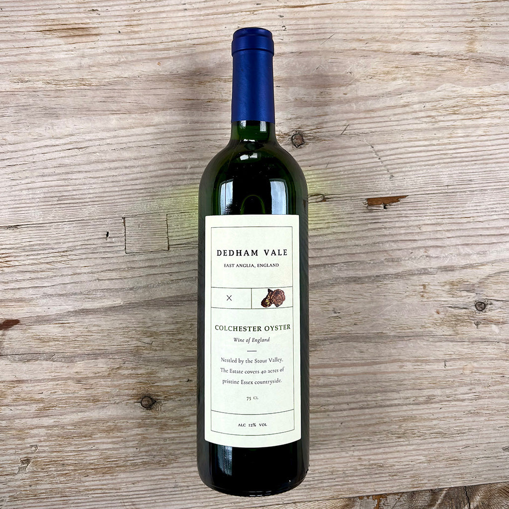 Wine bottle with a label on a wooden surface