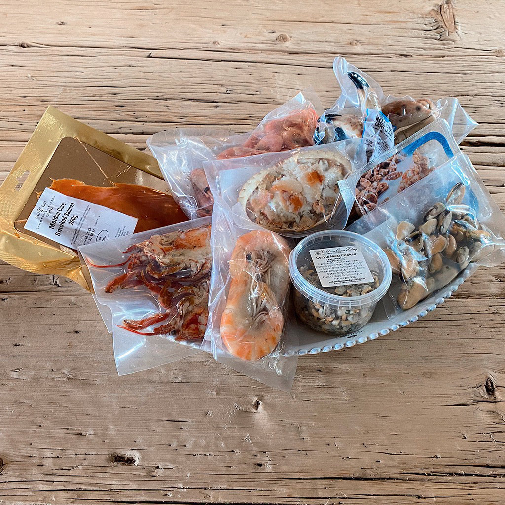 The seafood platter as it arrives, all items individually packaged.