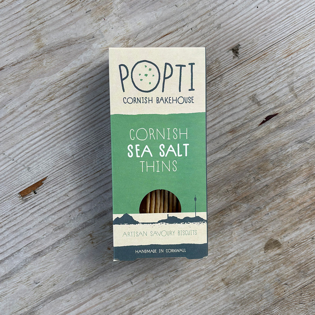 Pack of Cornish sea salt thins from Popti Cornish Bakehouse on a wooden surface