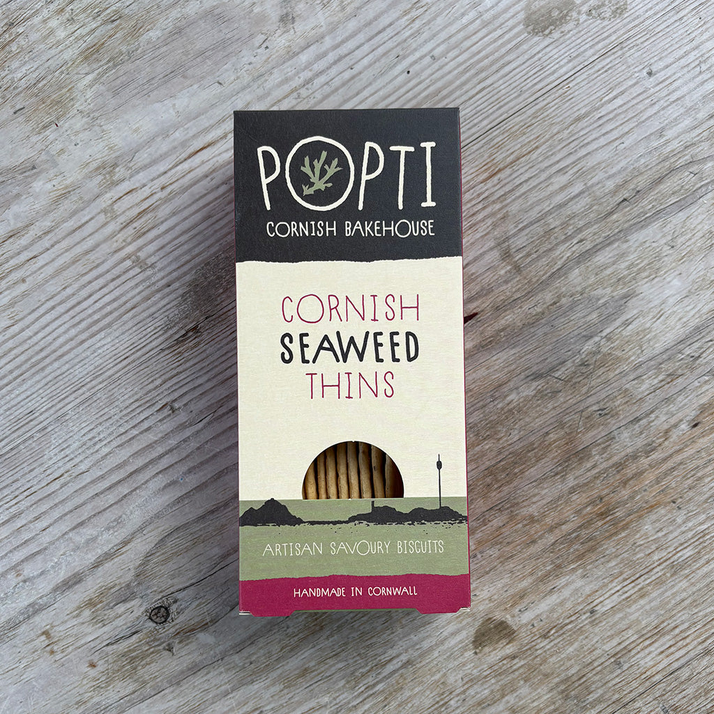 Box of Popti Cornish Seaweed Thins on a wooden surface